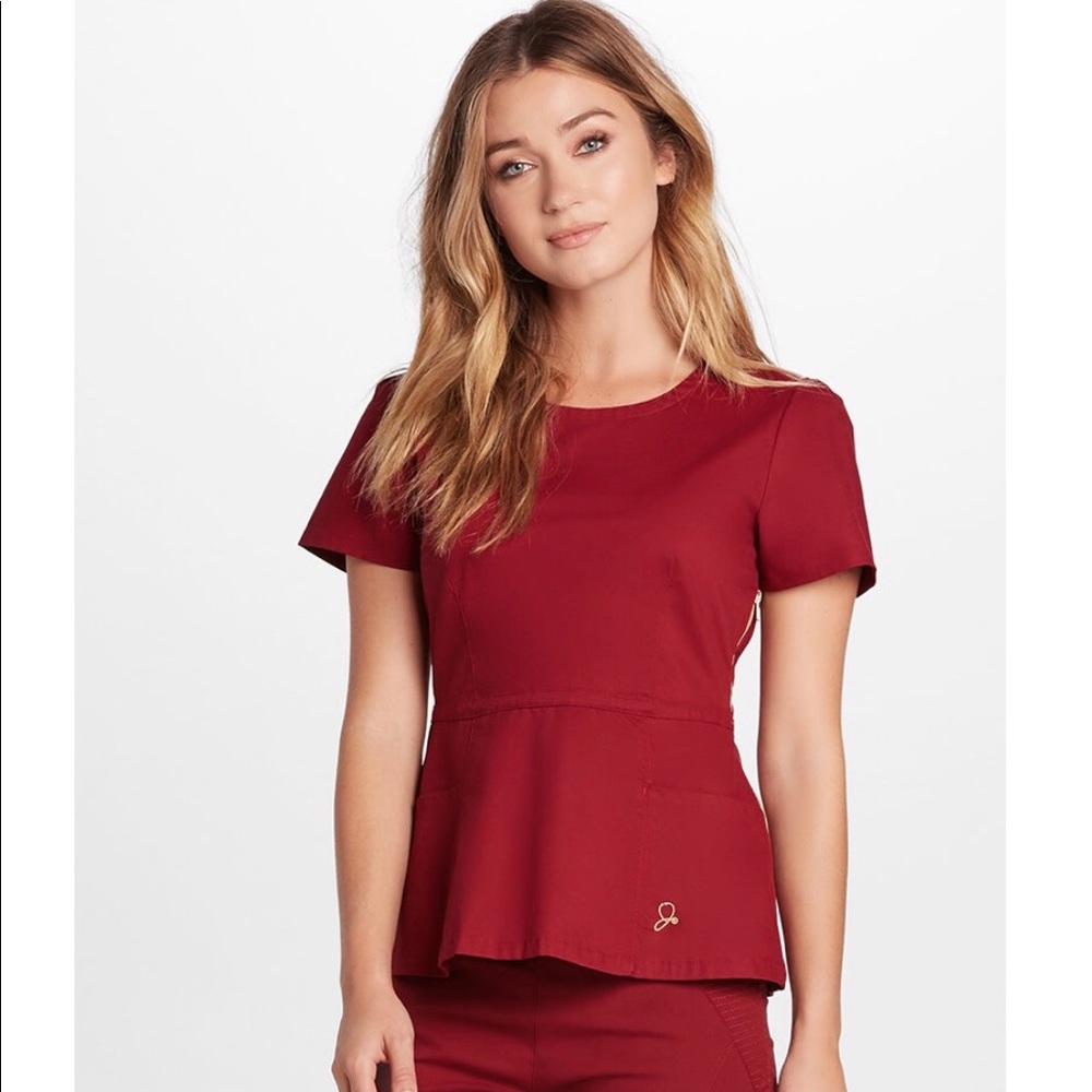 Jaanuu Rose Wine peplum scrub top